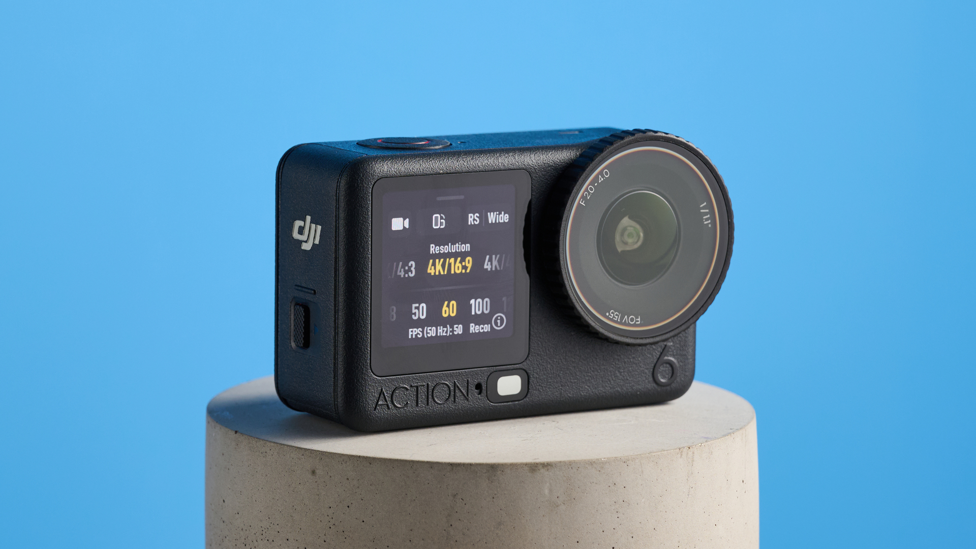 The DJI Osmo Action 6 on a stone surface with a blue background