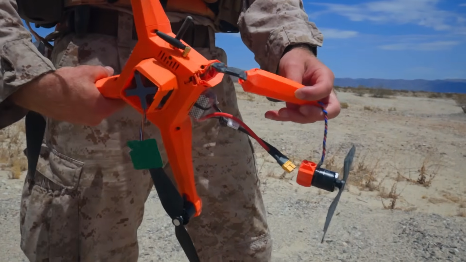 US Marine demonstrates bullet-damaged drone