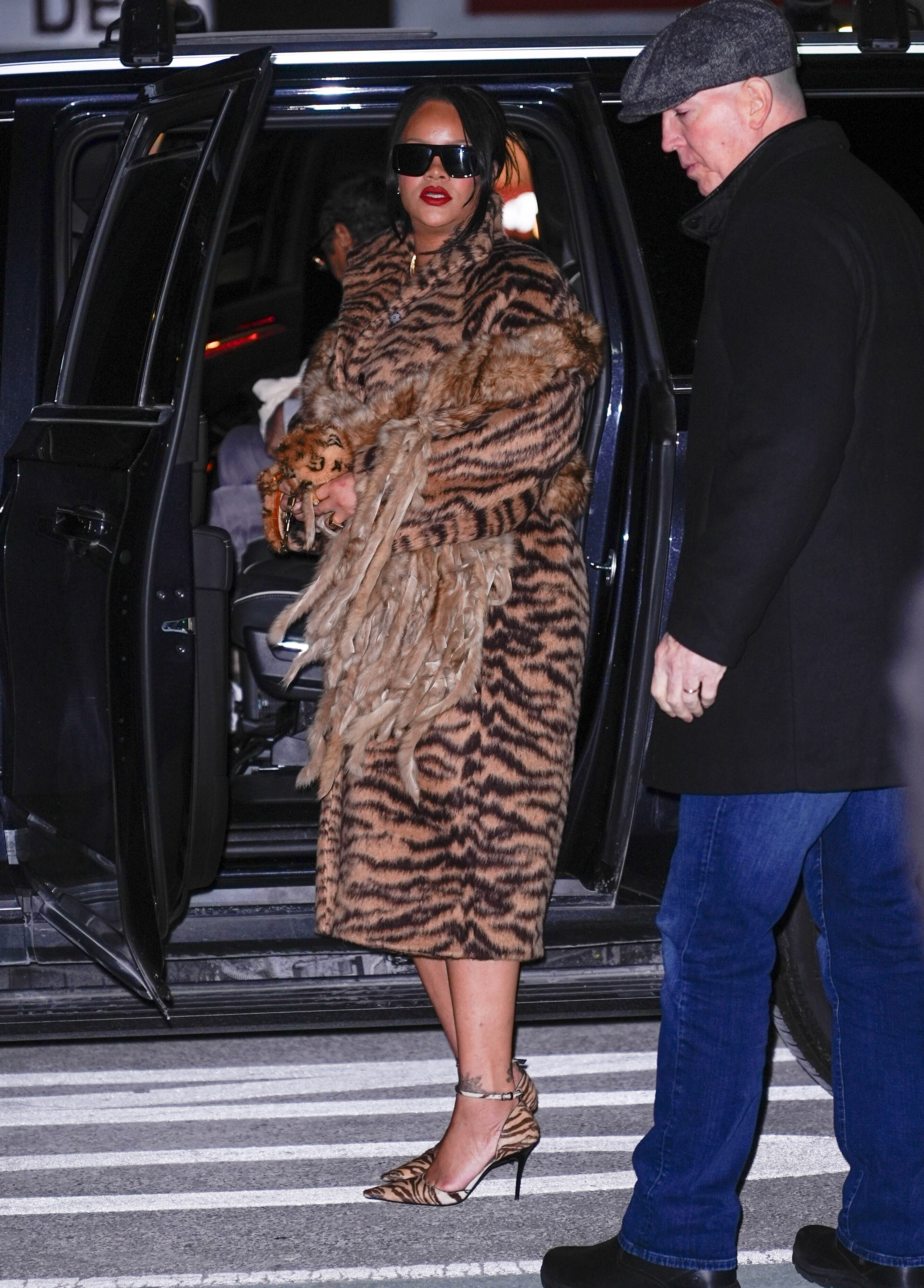 Rihanna paired her tiger print coat with a fur Louis Vuitton bag