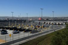 Vehicles enter a border checkpoint at the US Customs and Border Protection (CBP) San Ysidro Port of Entry at the US-Mexico border
