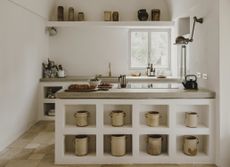 A kitchen with storage within the island