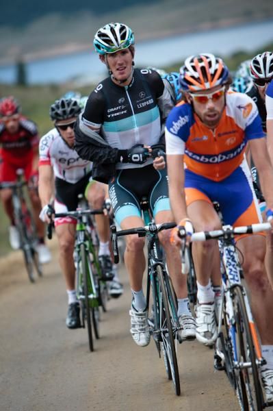 Andy Schleck (Leopard-Trek) removes a jacket after the rain stops.