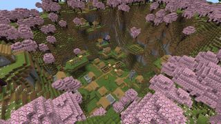 Minecraft seeds - a village in a valley ringed by cherry blossom trees