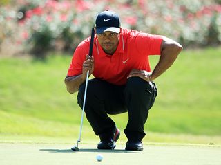 Tiger Woods reading a putt at the 2013 PLAYERS Championship