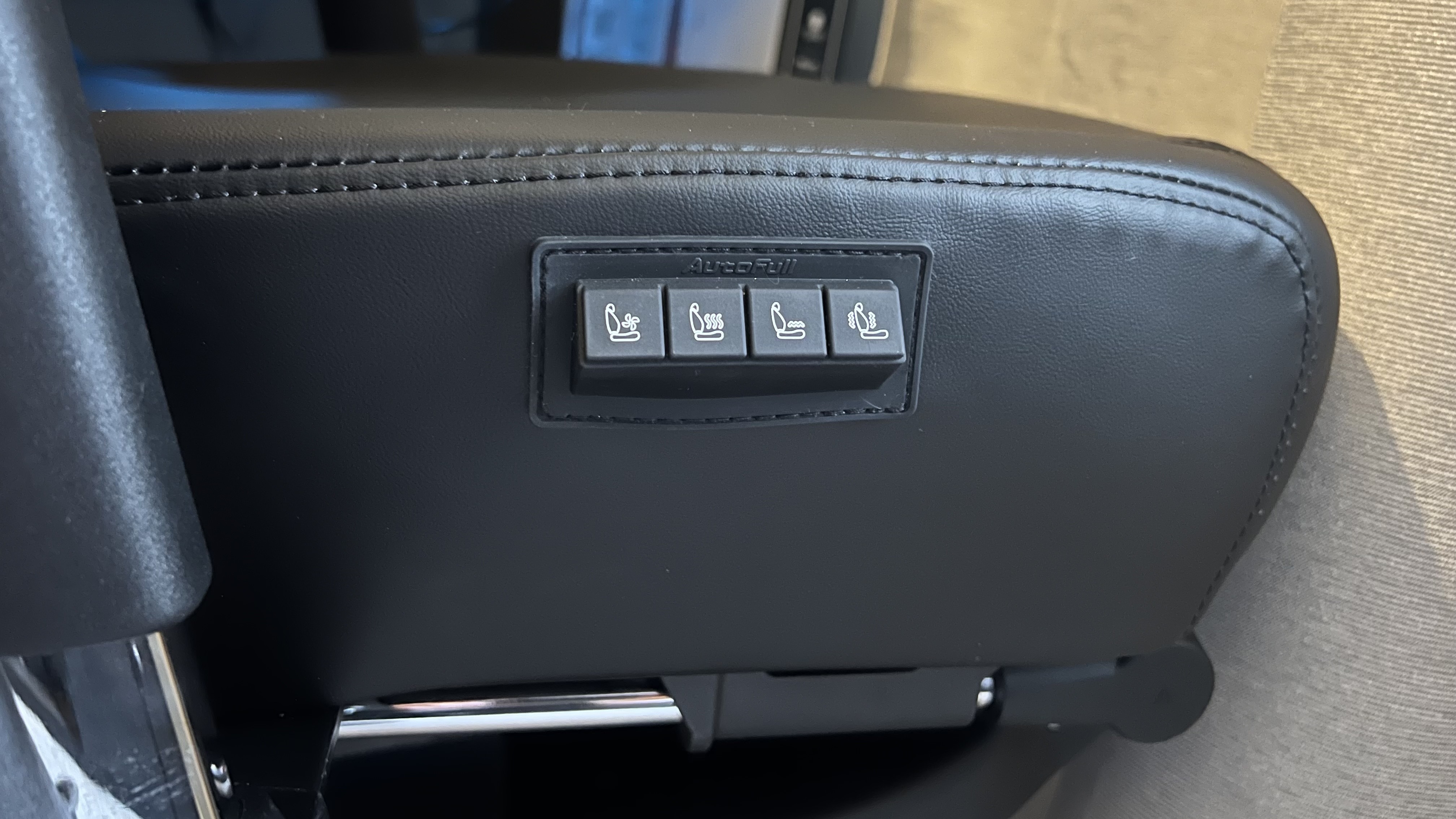 Close up on heating and massage controls on Autofull M6 Ultra 2.0 gaming chair