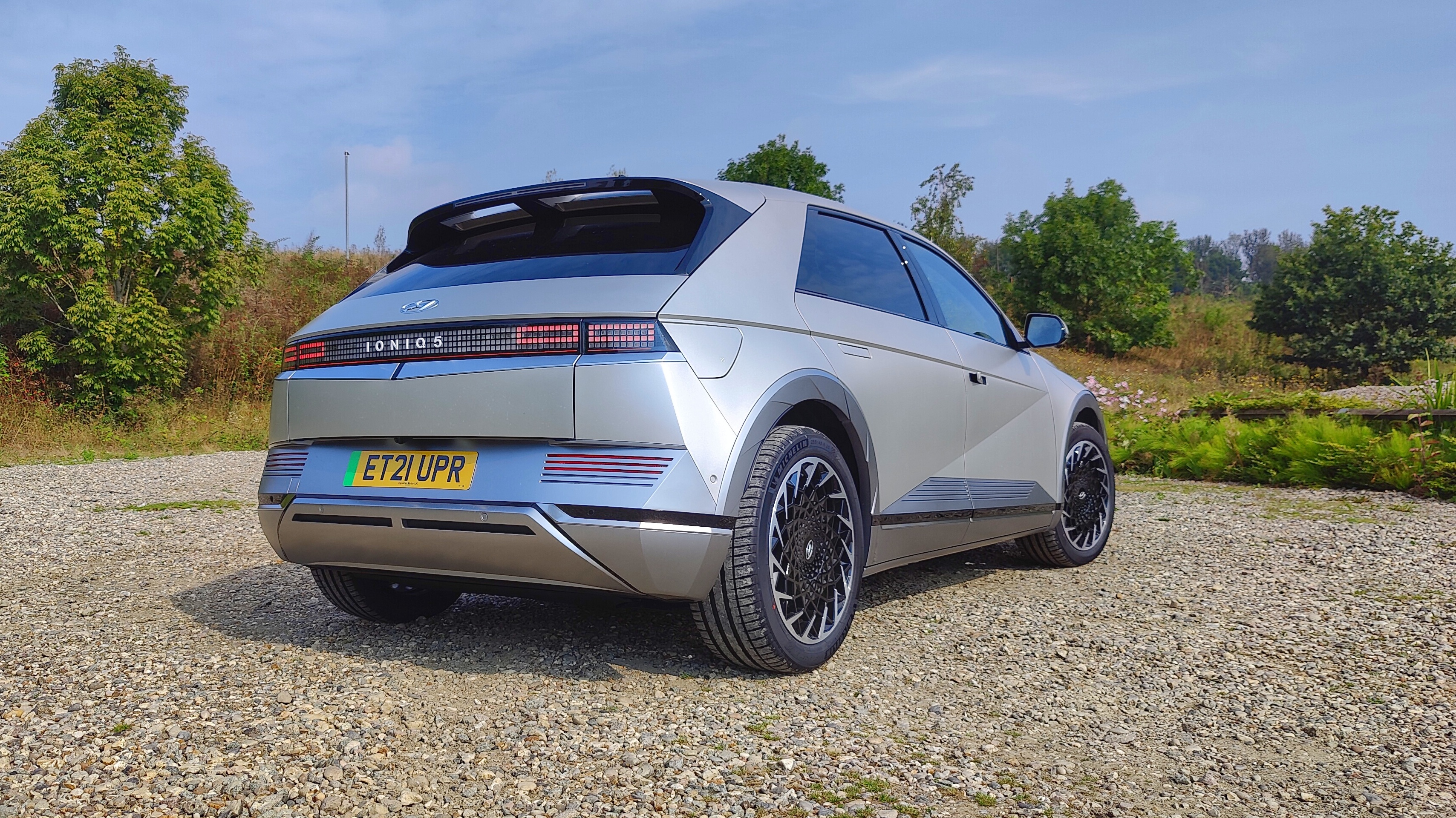 Rear-on, at an angle, view of Ioniq in gravel parking lot