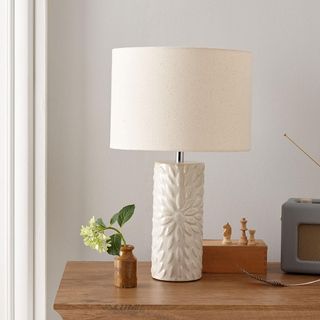 white room with table lamp