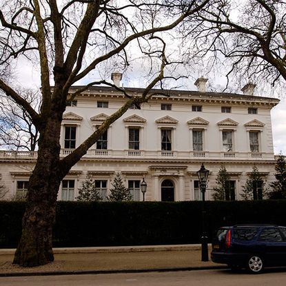 white london villa with front yard garden