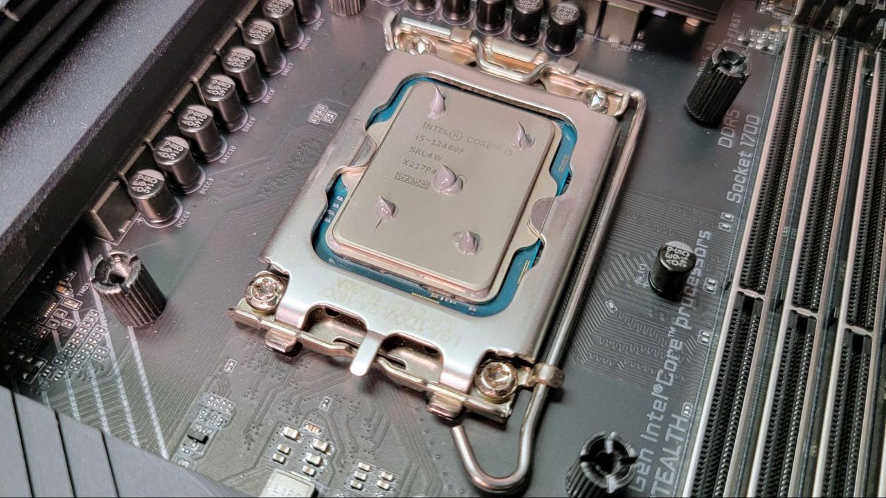 Five drops of thermal paste on an Intel CPU