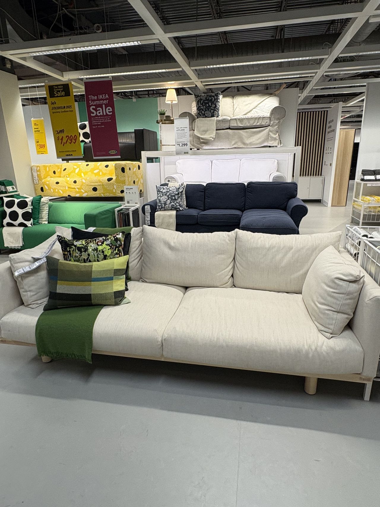 a white sofa from IKEA sits in a showroom.