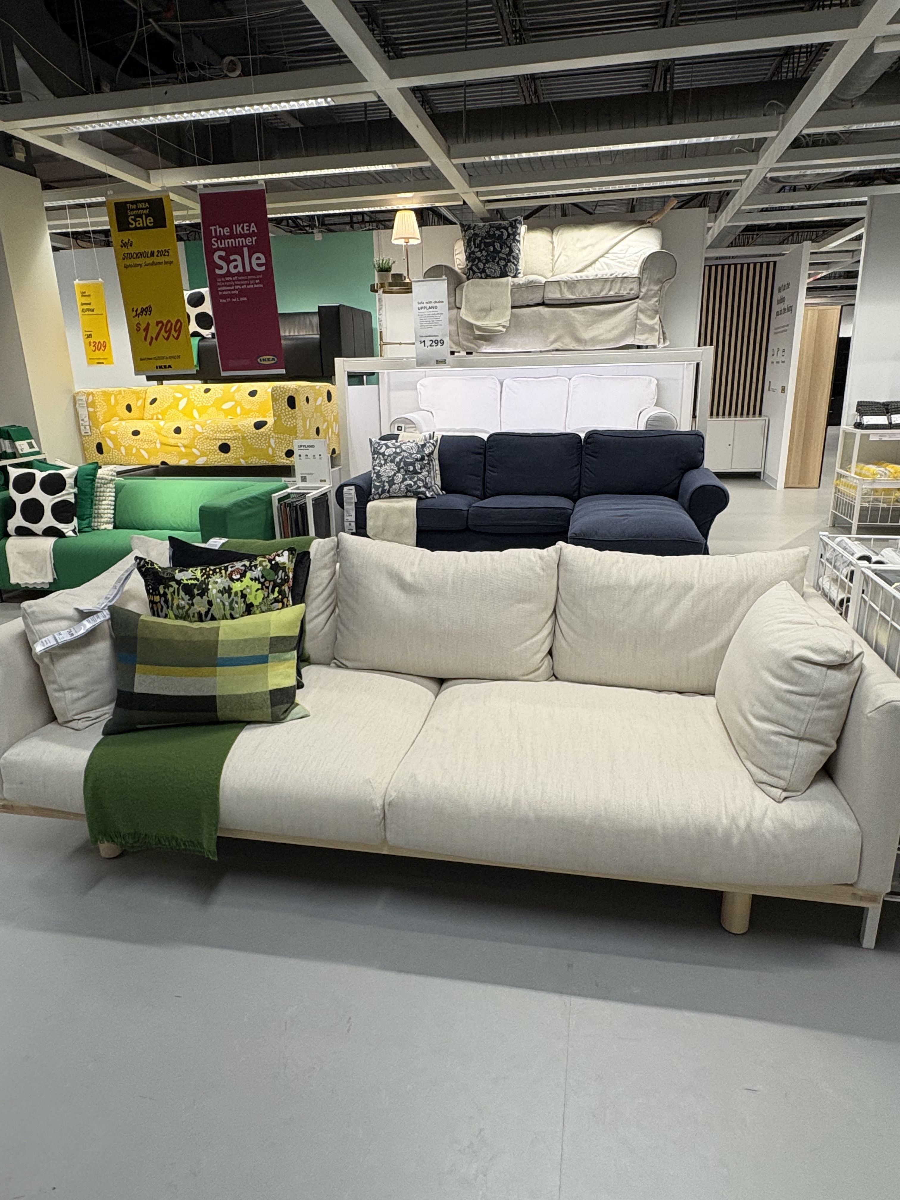 a white sofa from IKEA sits in a showroom.