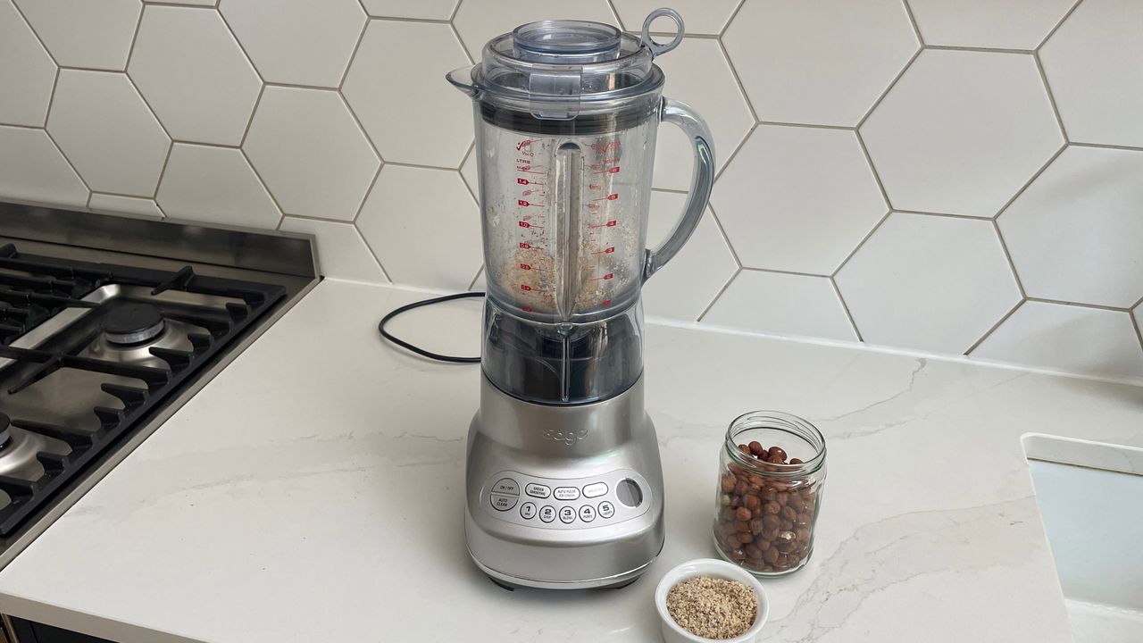 Breville the Fresh &amp; Furious on a kitchen countertop with crushed nuts