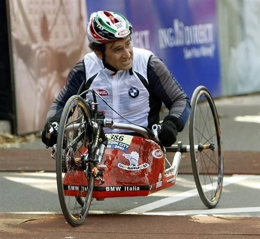 Italian driver Alex Zanardi, who lost both legs in a 2001 crash, crosses the finish line in the Handcycle Division of the New York Marathon.