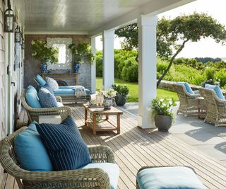 porch with rattan chairs and blue cushions