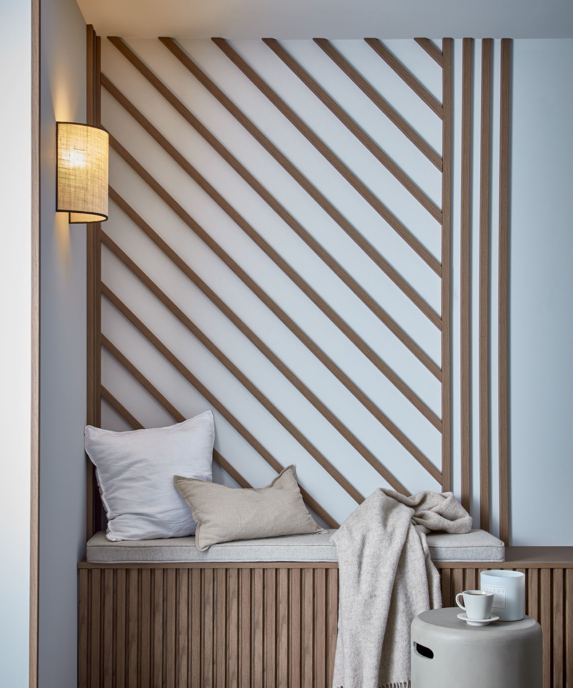 A wall featuring slanted panelling in a diagonal pattern