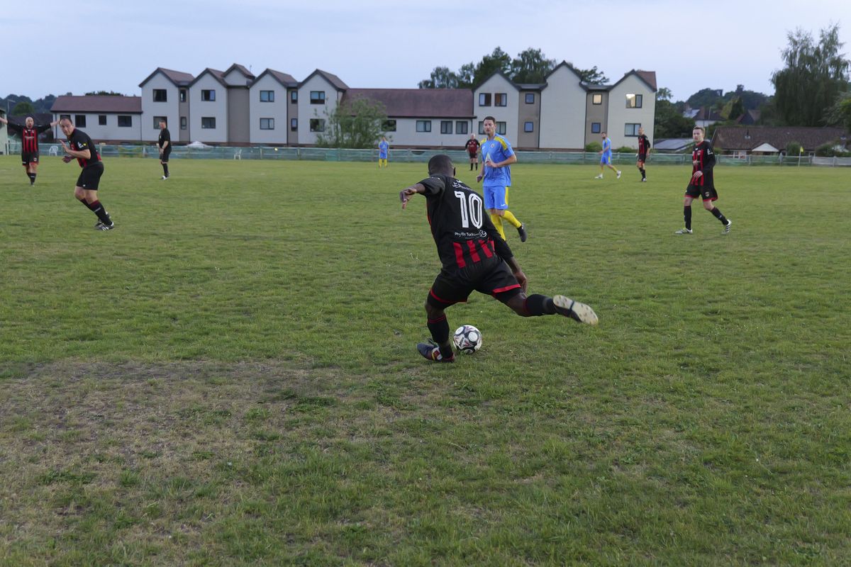 Panasonic Lumix S1 II sample gallery: footballers in action during game at last light