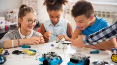 Science kit deals: Image of kids playing with science kit