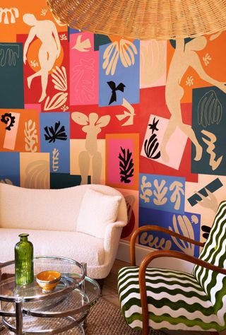 a living room with colorful wallpaper walls
