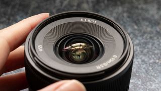 A close up photo of the Sony E 11m f/1.8 lens
