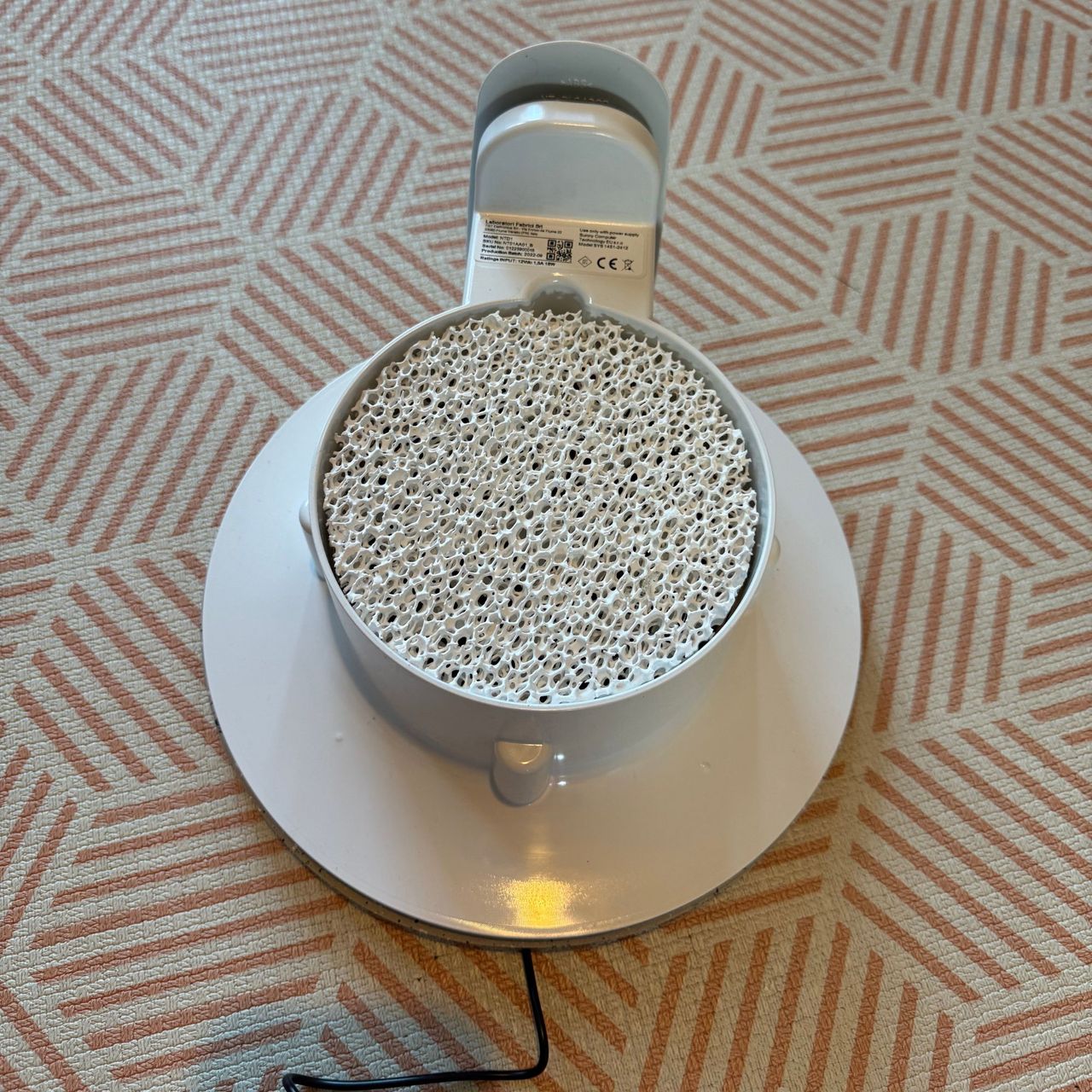 Vitesy Natede Smart air purifier and the filter on a orange and white rug