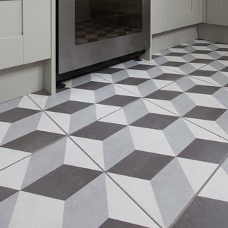 kitchen with patterned black and white tiles