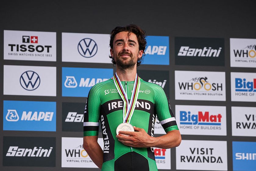 Bronze medallist Irish rider Ben Healy poses on the podium following the men&#039;s Elite road race cycling event during the UCI 2025 Road World Championships, in Kigali, on September 28, 2025. (Photo by Anne-Christine POUJOULAT / AFP)
