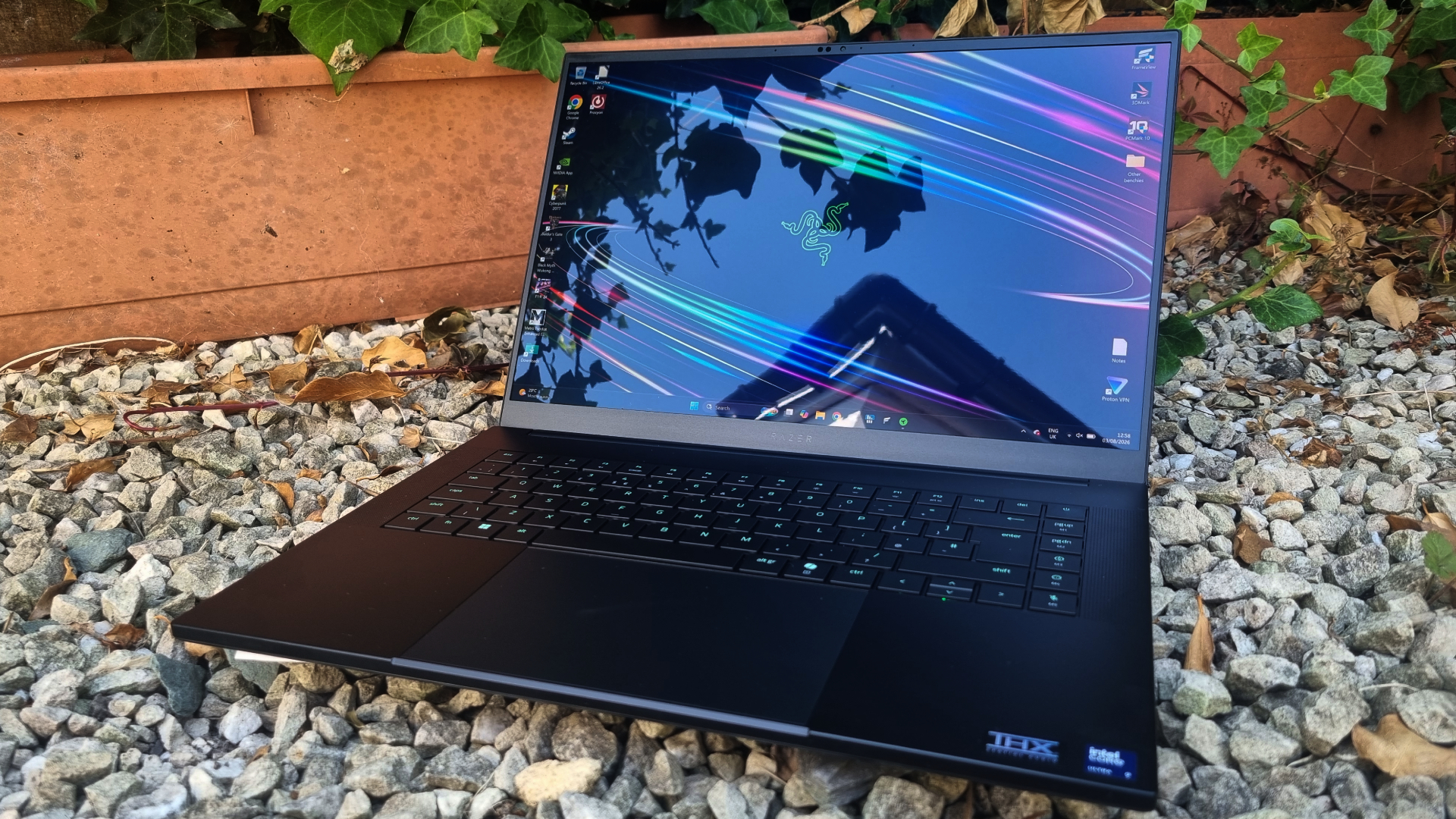 A Razer Blade 16 (2026) gaming laptop on white gravel
