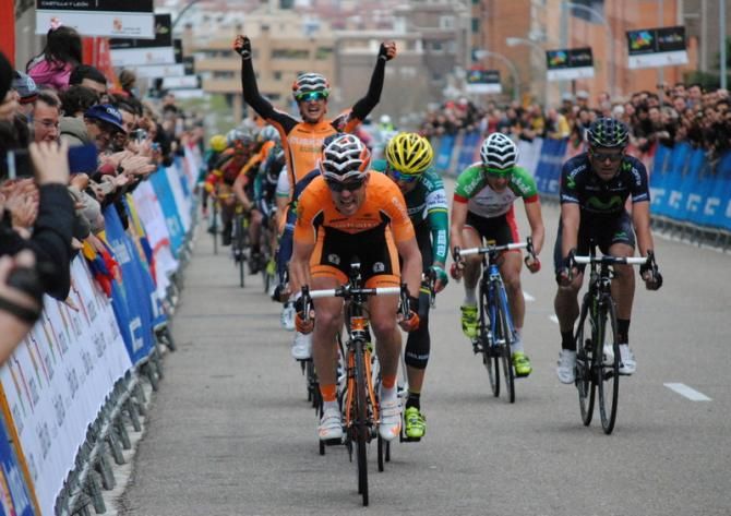 As Pablo Urtasun (Euskaltel Euskadi) speeds towards victory on stage 1, his teammate Juan Jose Lobato is already celebrating.