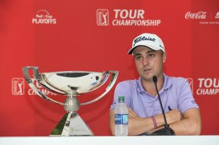 Justin Thomas next to the FedEx Cup at a press conference in 2017