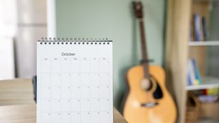 Calendar desk place on table. Desktop Calender for Planner to plan agenda, timetable, appointment, organization, management each date, month, and year on wooden office table.Calendar Concept.