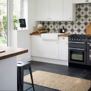 kitchen with tiles on wall gas and sink