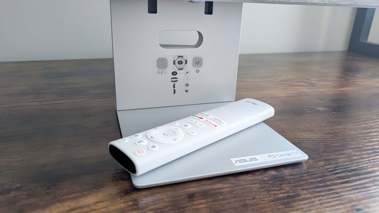 ASUS ZenScreen Smart TV MS27UC's remote on the base.
