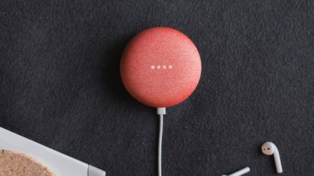 Lifestyle image of the pink Google Nest Mini