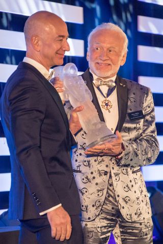 Jeff Bezos receives the first annual Buzz Aldrin Space Innovation Award from Apollo 11 moonwalker Buzz Aldrin at an Apollo 11 anniversary gala on July 15, 2017.
