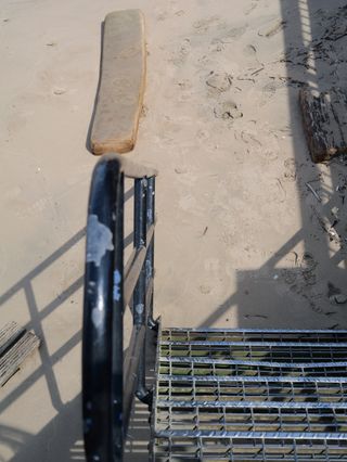 Steps leading down to a sandy beach