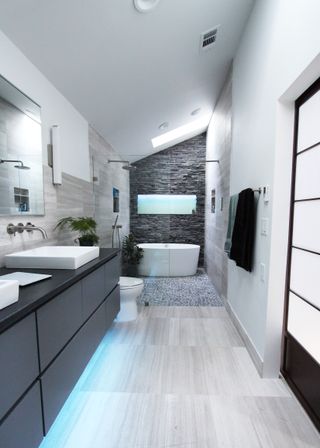 narrow bathroom in black and white