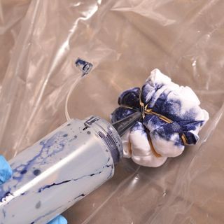 white napkin with squeezy bottle and blue ink