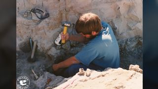 Vertebrate paleontologist Brian Curtice digs for dinosaur bones.