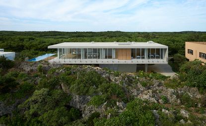 house on the Japanese island of Ikema is made of reinforced, cast-in-place concrete with impact-resistant glazing systems.