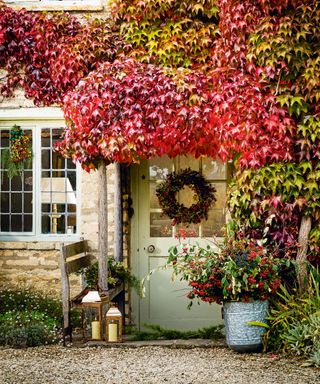 Outdoor fall decor with front door wreath