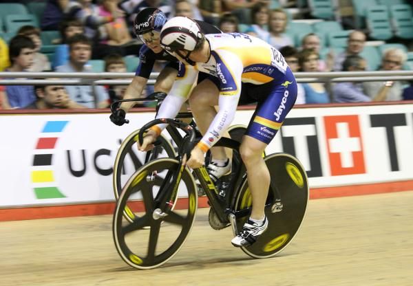 Australia's Daniel Ellis tries to hold Chris Hoy (GB-Sky) up on the barriers in the men's sprint QF