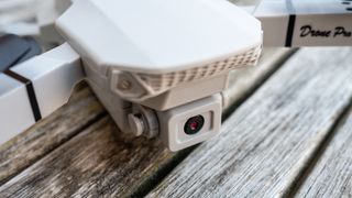 Cheap 4K drone on a table close up of the camera