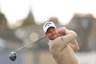 Danny Willett watches his tee shot with a driver