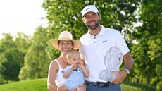 Scottie Scheffler, Meredith and Bennett pose with the Memorial Tournament trophy in 2025