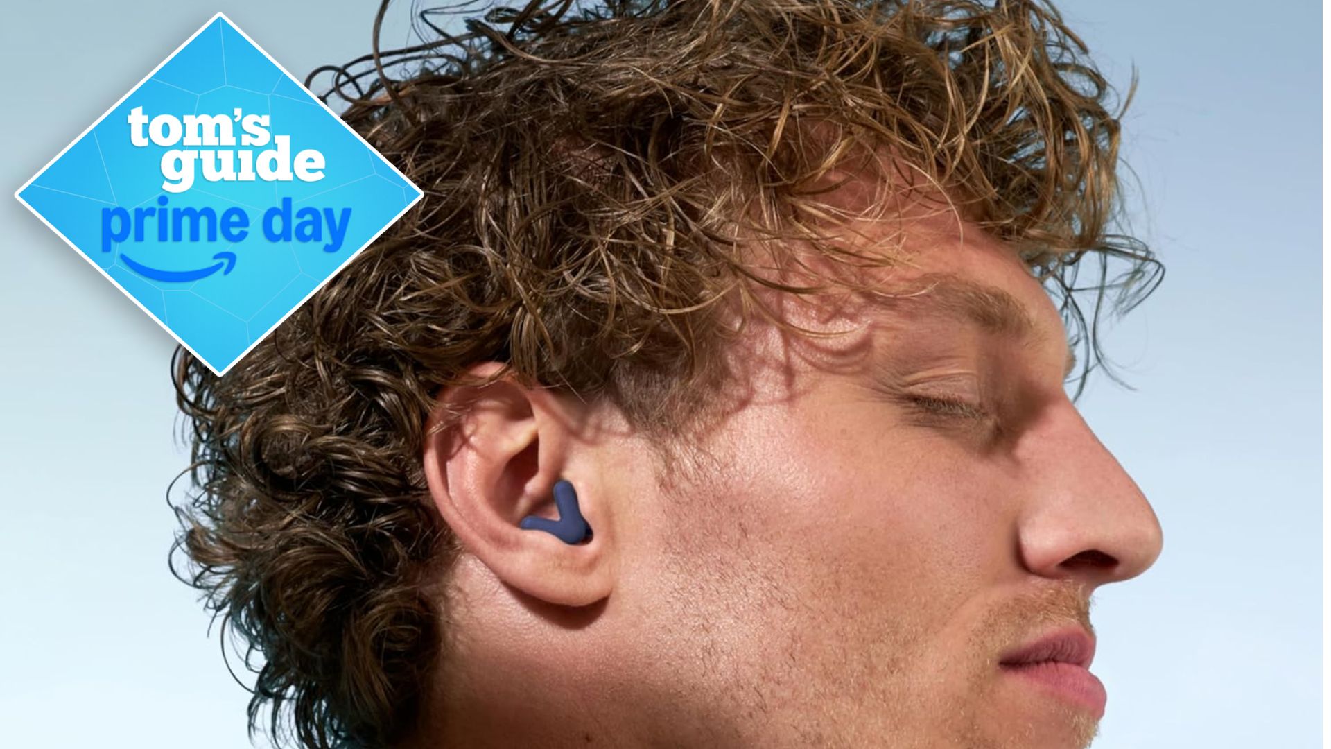 A man wearing the Alpine Silence Earplugs with his eyes closed