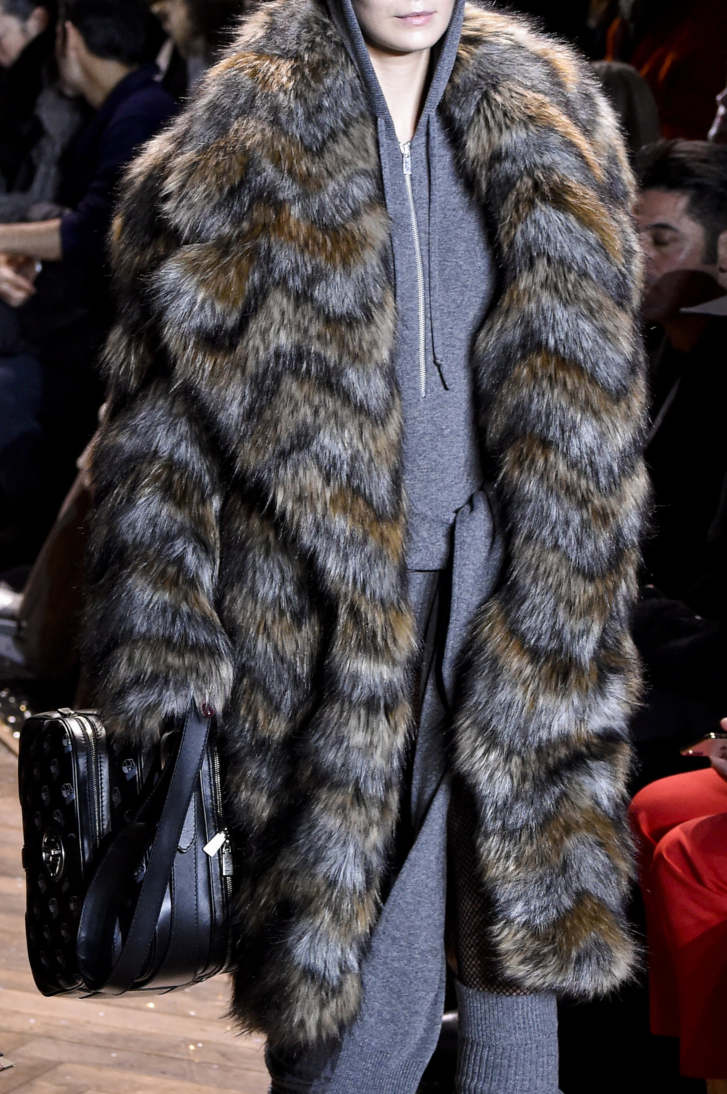 a model wearing a fur coat at new york fashion week