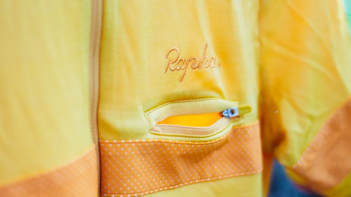 a small zipped chest pocket on a yellow jersey