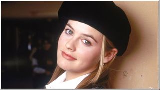 Alicia Silverstone as Cher, wearing a beret and warm/ brown/nude lipstick