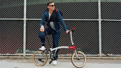 Image shows David Millar with a Brompton CHPT3 v4 in New York City