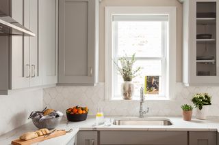 A kitchen bathed in warm gray tones